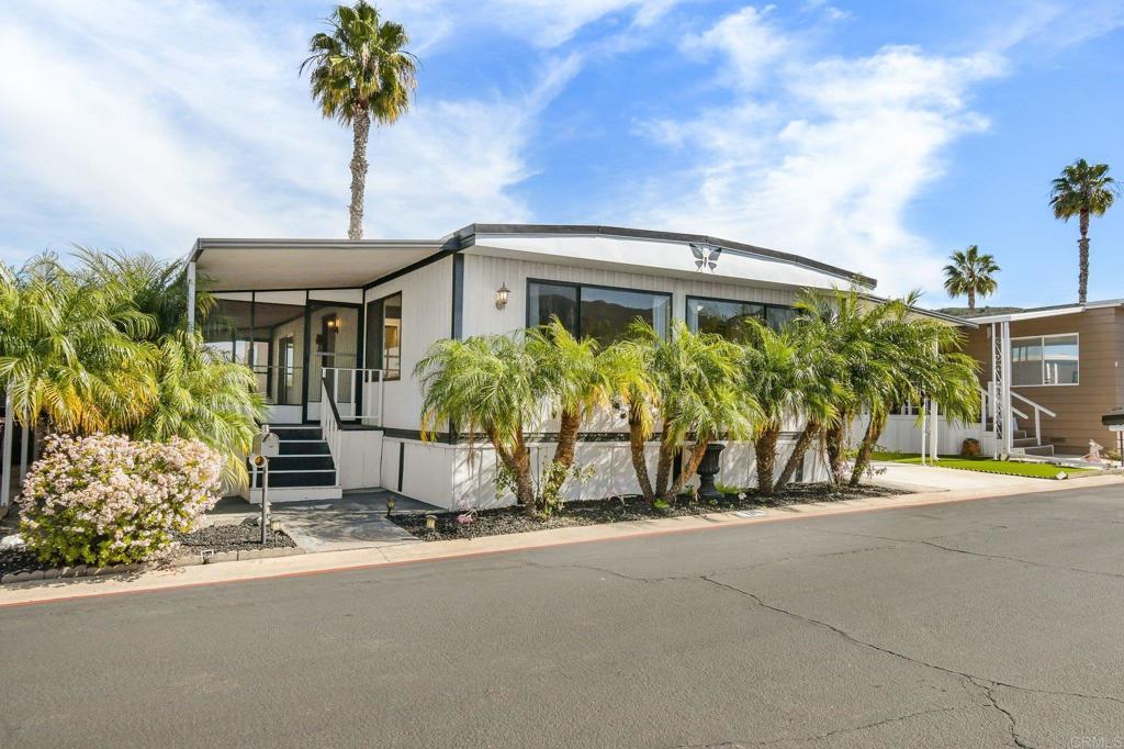 8301 Mission Gorge Road, Unit 131 Santee, CA 92071 - Photo 2 of 38 a front view of a house with garden
