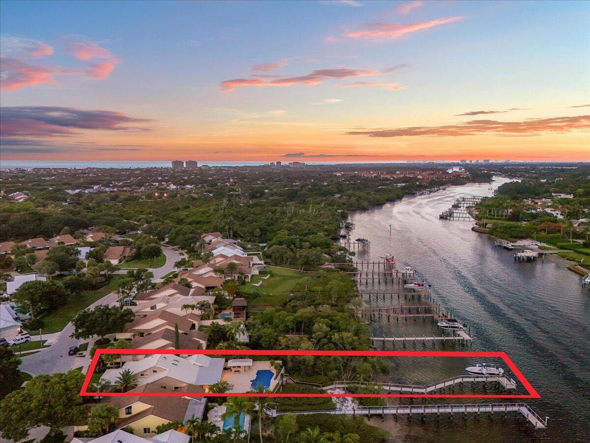 352 River Edge Road Jupiter, FL 33477 - Photo 45 of 56 Twilight aerial facing South