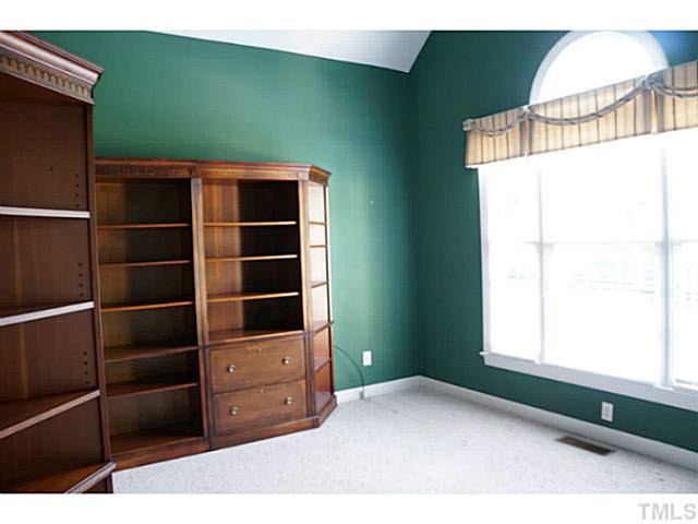 7624 Wilderness Road Raleigh, NC 27613 - Photo 7 of 25 Presently used as a office (bookshelves not included) this room could make a lovely formal sitting area, music room or whatever your life style needs may be. Studio/Study/Office