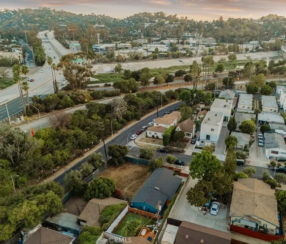a bedroom with a bed and a night stand