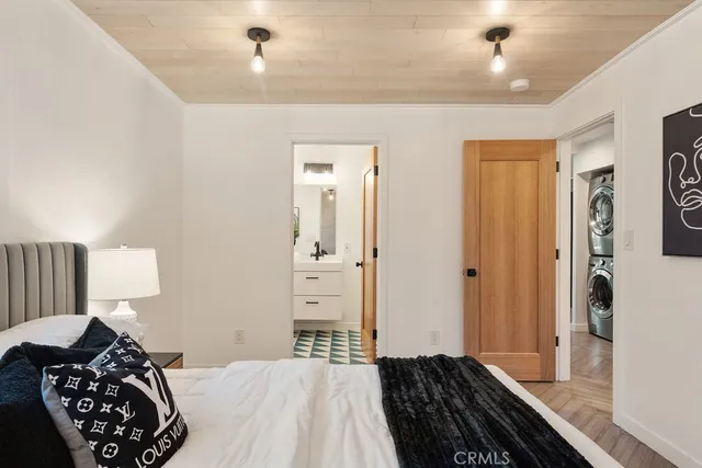 a kitchen with stainless steel appliances granite countertop a refrigerator a sink and a stove