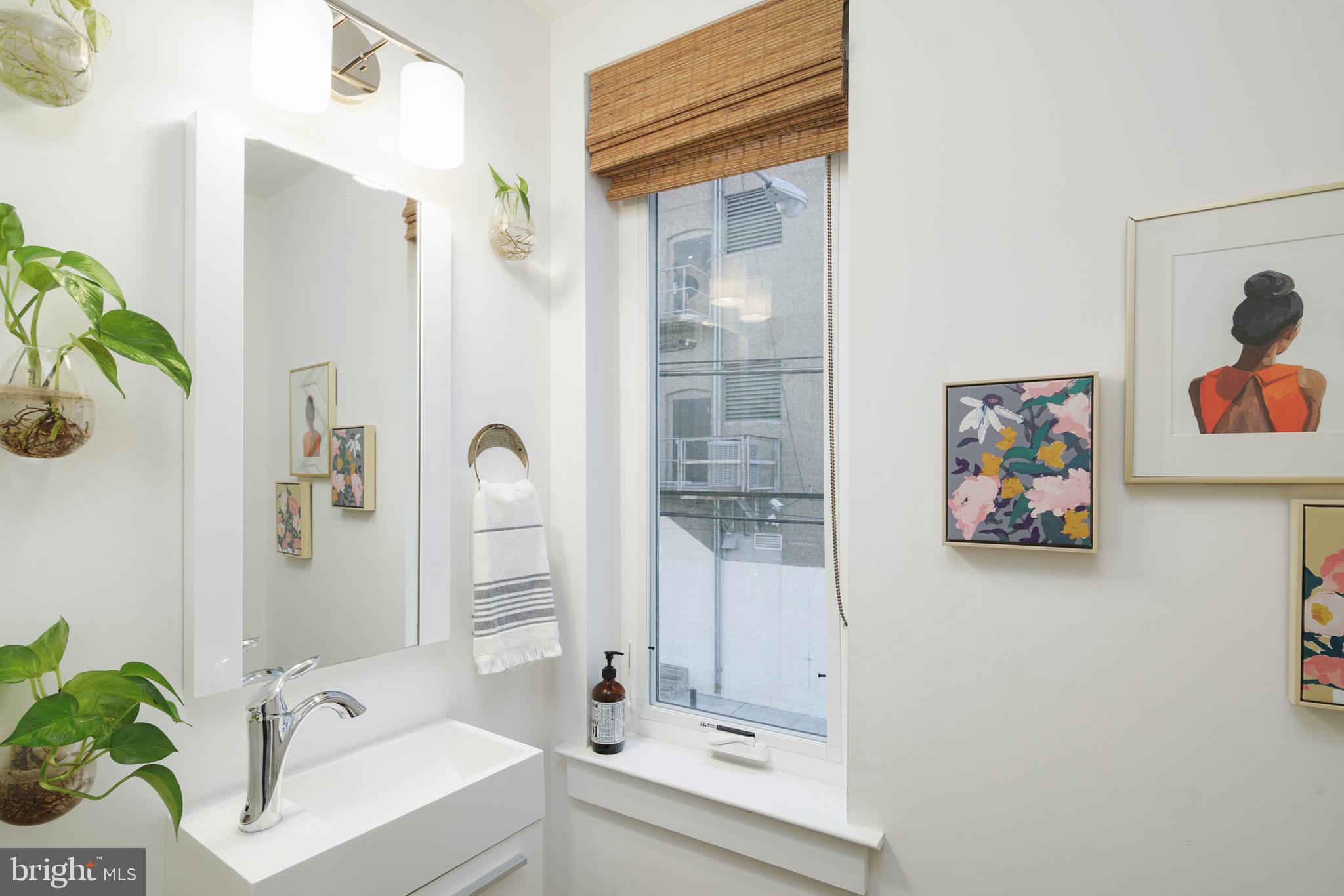159 East Allen Street, Unit 1 Philadelphia, PA 19125 - Photo 27 of 45 a bathroom with a tub sink and mirror