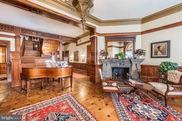a living room with furniture a fireplace and a table