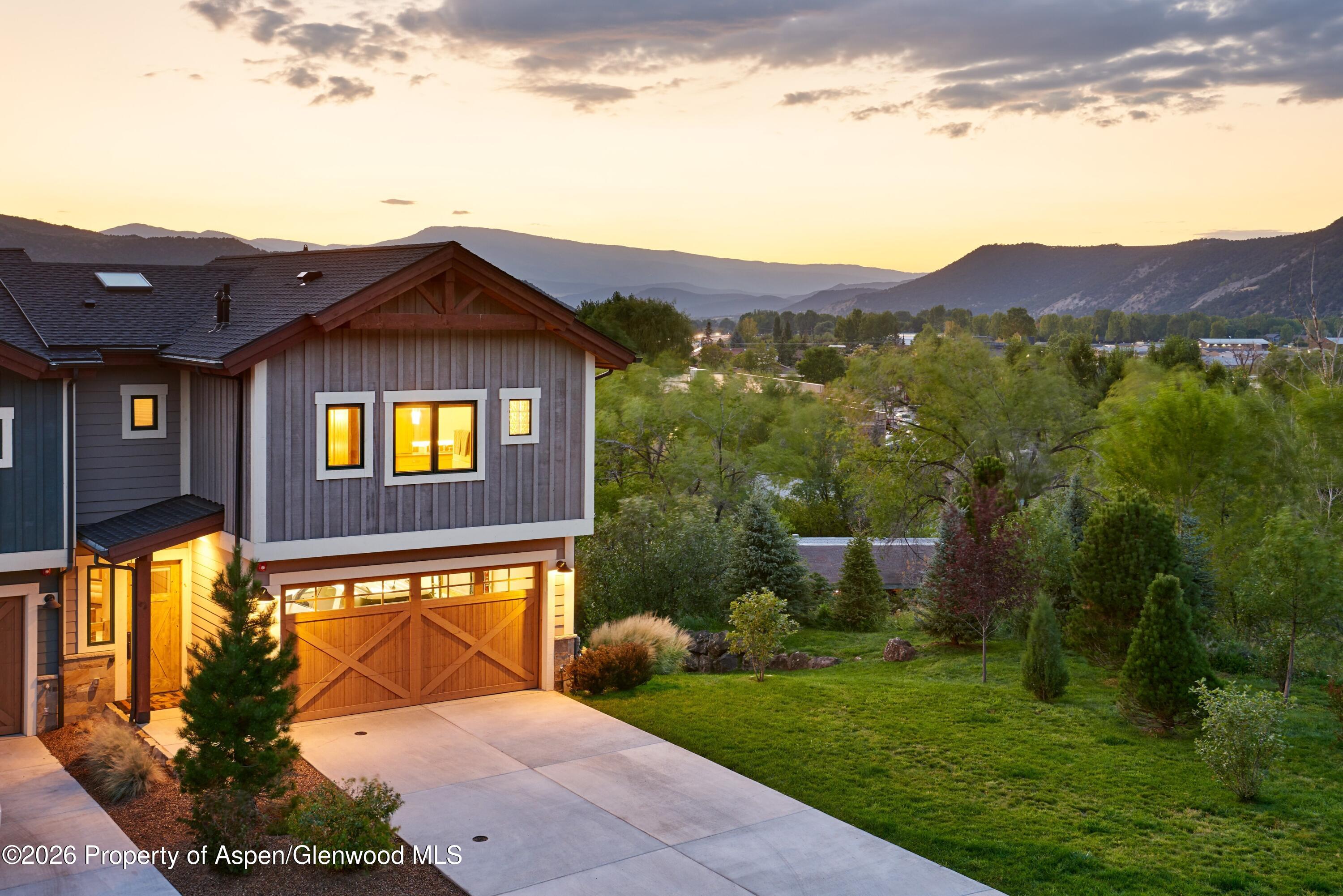 219 Overlook Ridge Basalt, CO 81621 - Photo 1 of 34 a view of a big house with a big yard and large trees