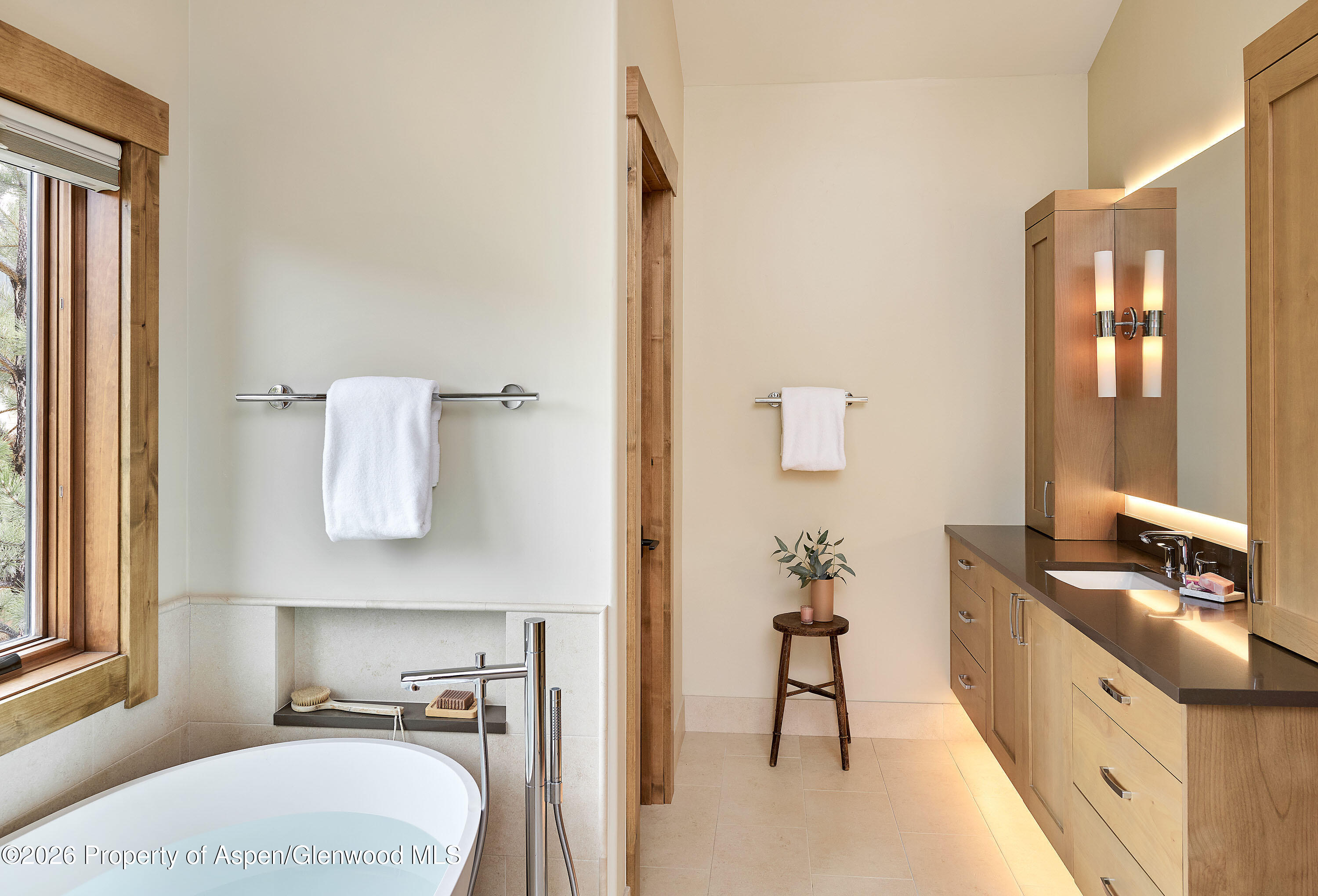 219 Overlook Ridge Basalt, CO 81621 - Photo 12 of 34 a spacious bathroom with a granite countertop sink and a mirror
