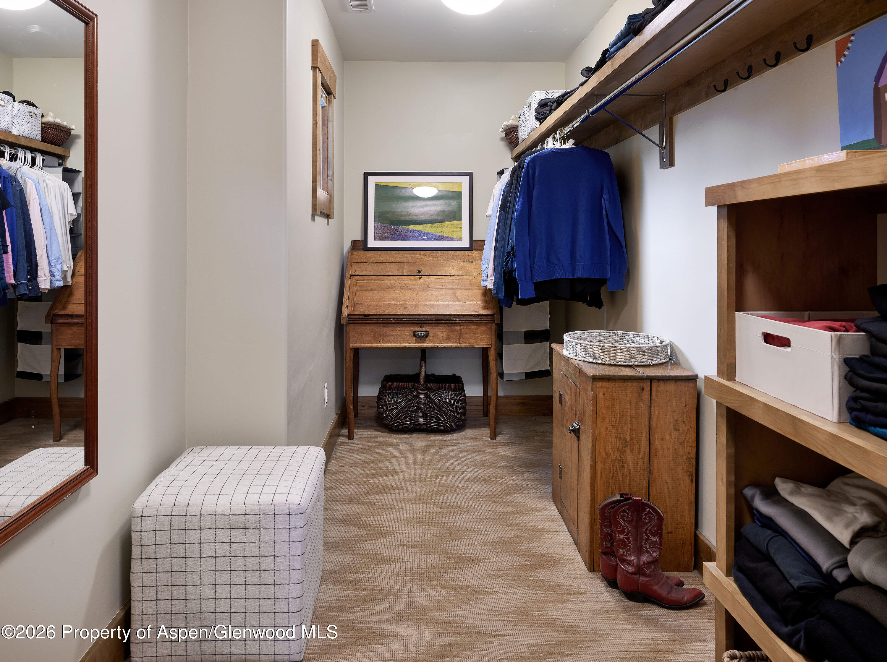 219 Overlook Ridge Basalt, CO 81621 - Photo 14 of 34 a living room with furniture a flat screen tv and gym equipment