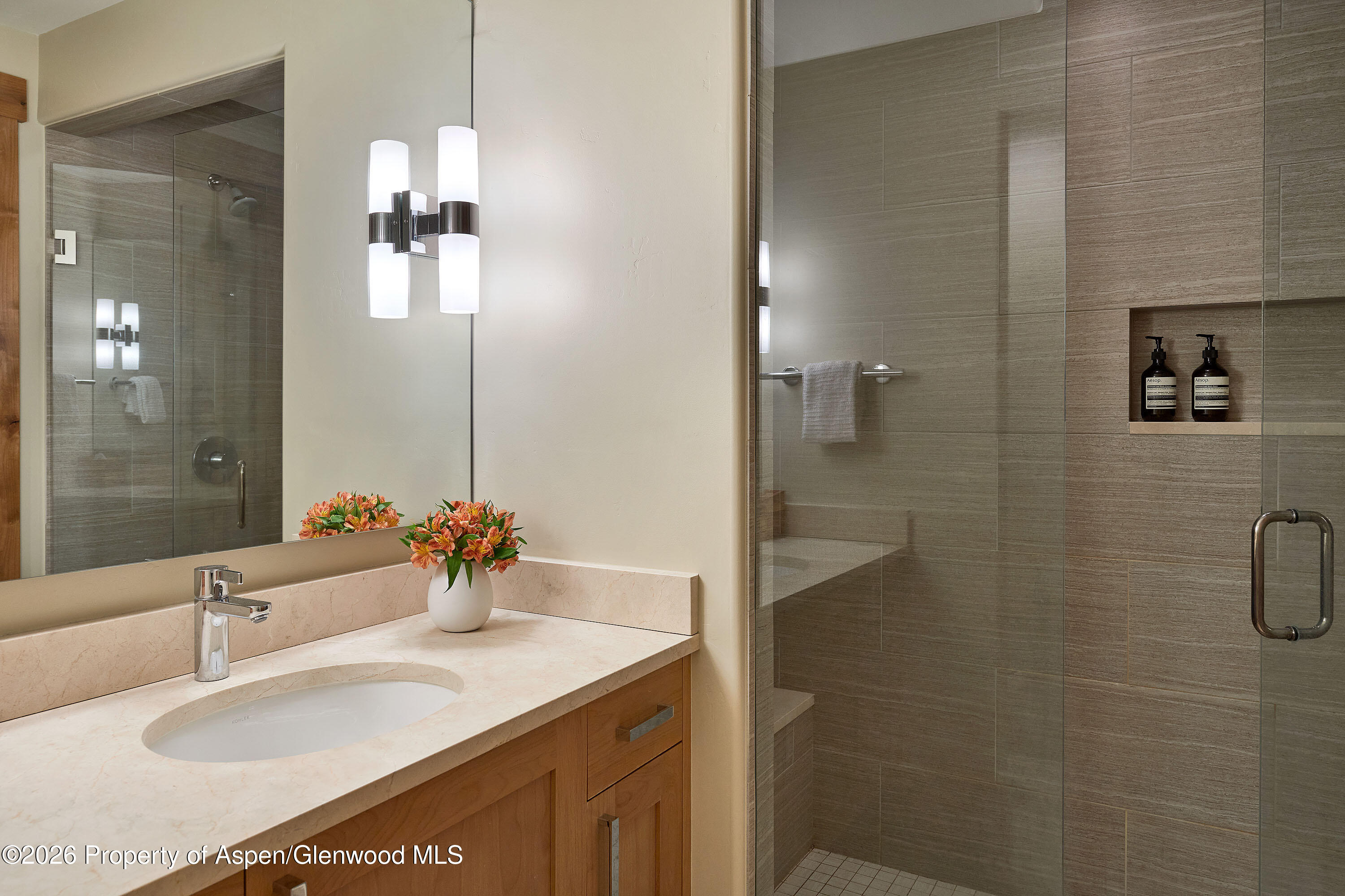 219 Overlook Ridge Basalt, CO 81621 - Photo 21 of 34 a bathroom with a granite countertop sink a shower and a mirror