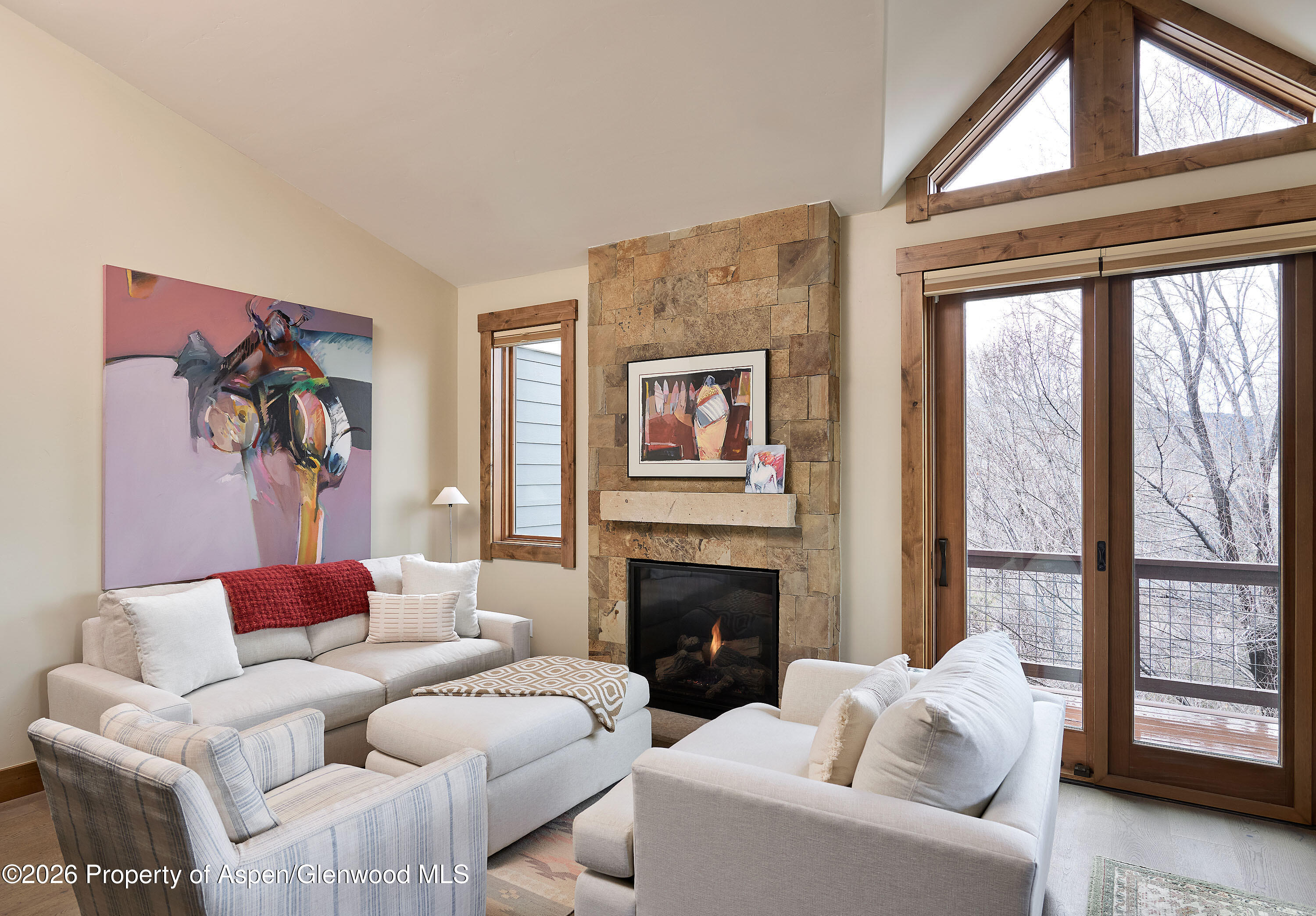 219 Overlook Ridge Basalt, CO 81621 - Photo 3 of 34 a living room with furniture a large window and a fireplace