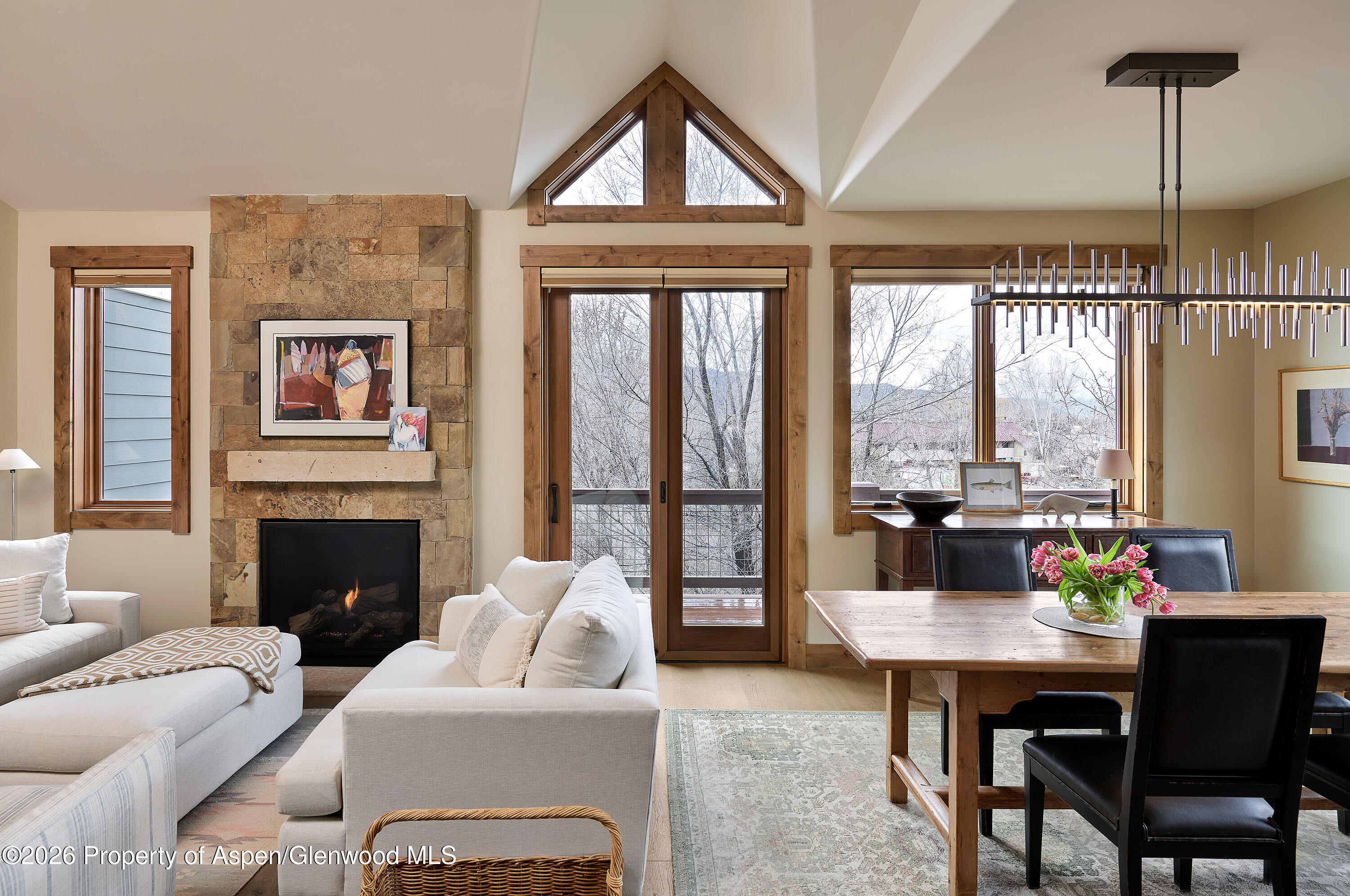 219 Overlook Ridge Basalt, CO 81621 - Photo 4 of 34 a living room with furniture a fireplace and a floor to ceiling window