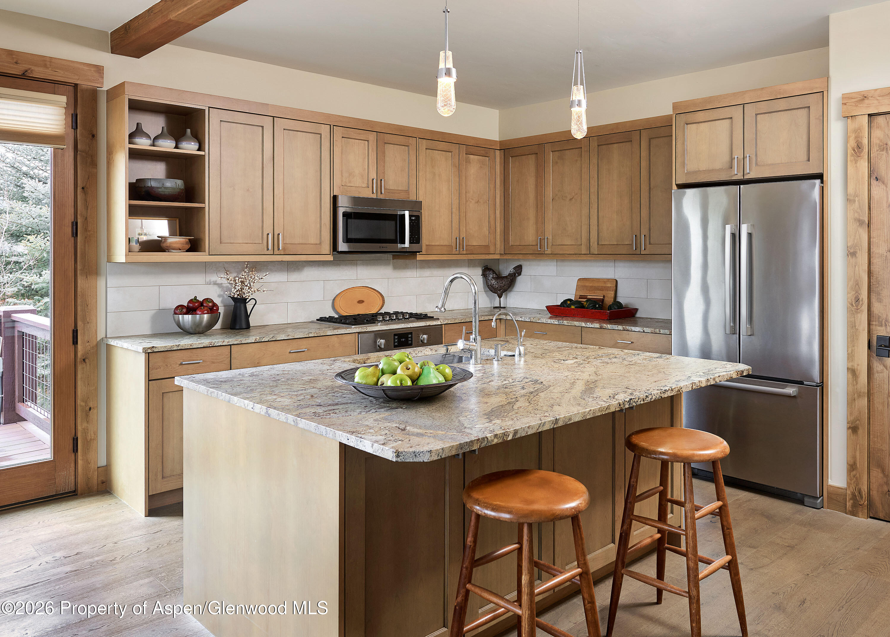 219 Overlook Ridge Basalt, CO 81621 - Photo 7 of 34 a kitchen with stainless steel appliances granite countertop a table chairs sink refrigerator and microwave