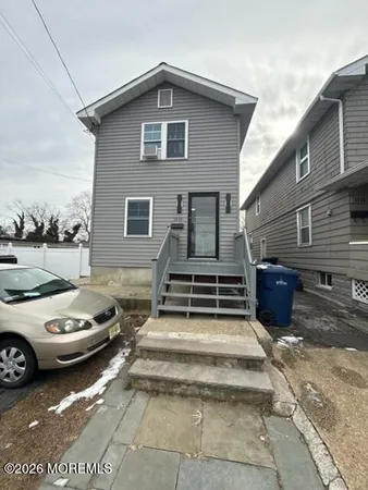 a view of a car parked in front of a house