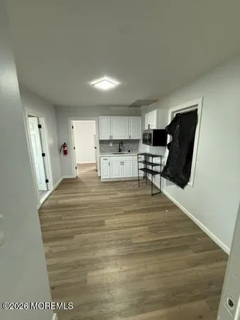 a room with a bed and furniture