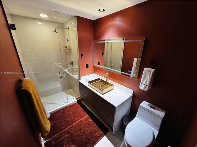 a living room with furniture and a mirror