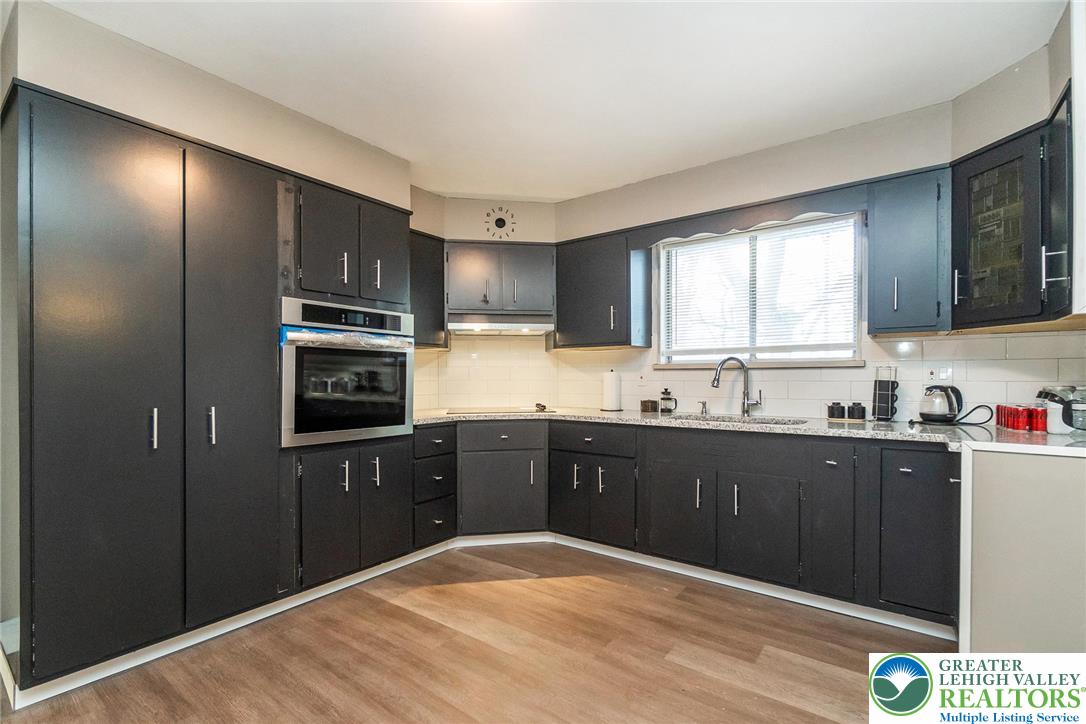 7243 Kingstead Drive Slatington, PA 18080 - Photo 11 of 36 a kitchen with stainless steel appliances granite countertop a refrigerator and sink