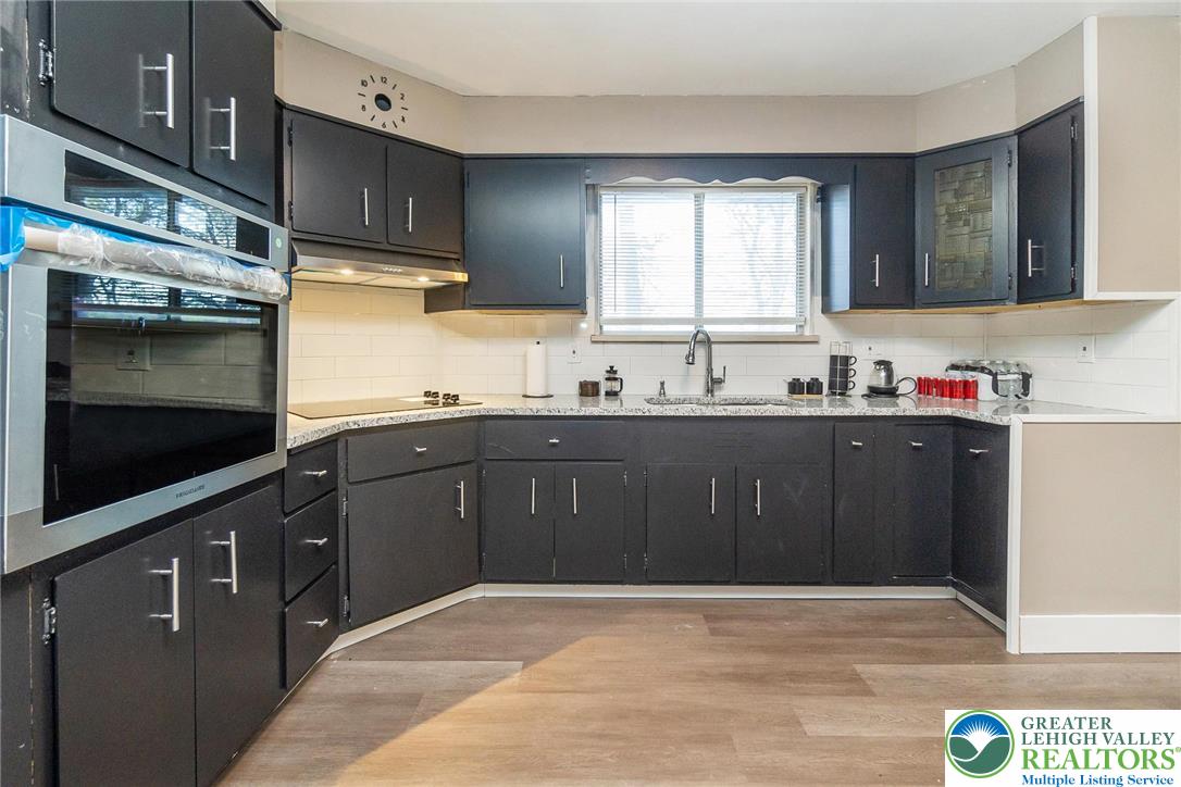 7243 Kingstead Drive Slatington, PA 18080 - Photo 12 of 36 a kitchen with a sink and cabinets