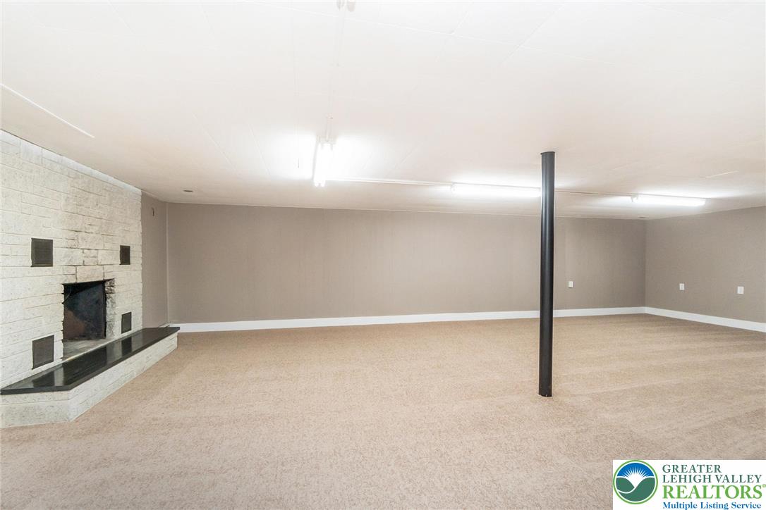 7243 Kingstead Drive Slatington, PA 18080 - Photo 29 of 36 a view of an empty room with a fireplace