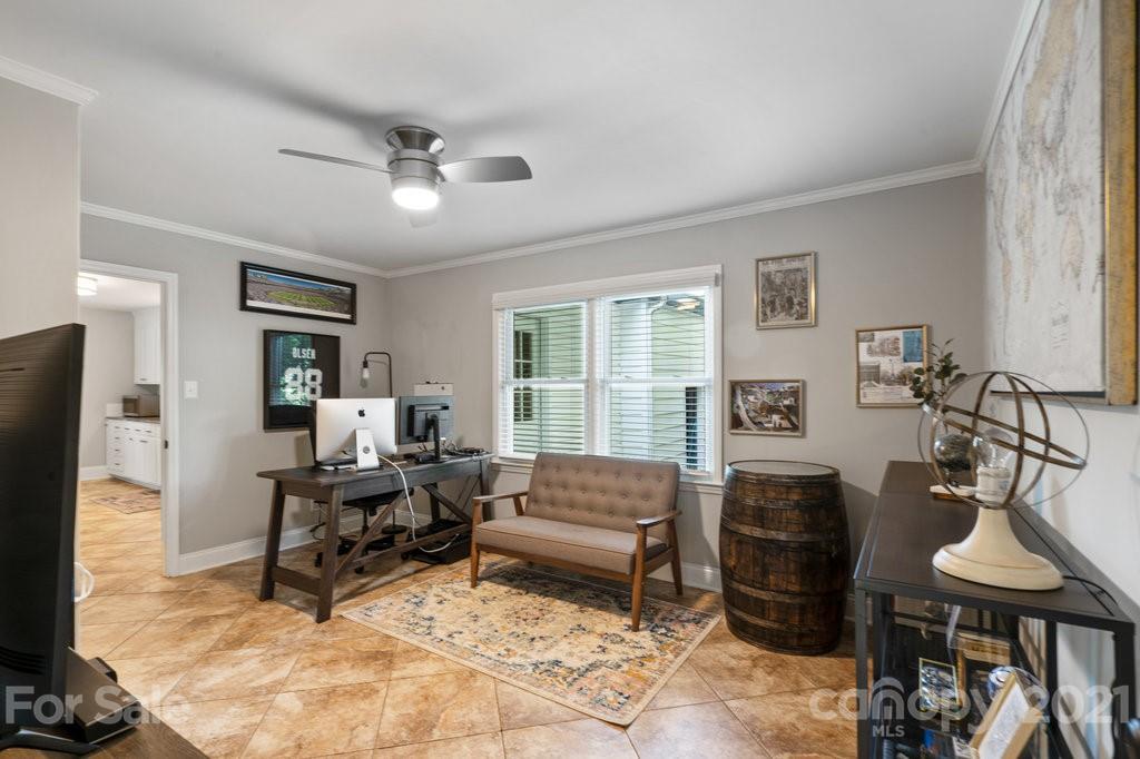 4326 Castleton Road Charlotte, NC 28211 - Photo 17 of 33 a living room with furniture a window and a flat screen tv