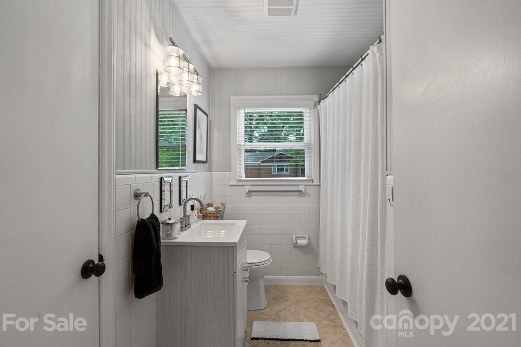4326 Castleton Road Charlotte, NC 28211 - Photo 21 of 33 a bathroom with a sink toilet and shower