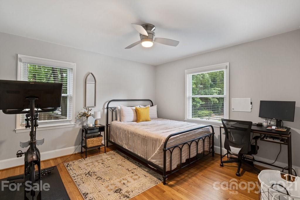4326 Castleton Road Charlotte, NC 28211 - Photo 22 of 33 a bedroom with a bed and a desk