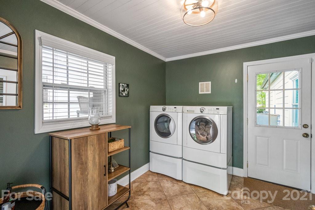 4326 Castleton Road Charlotte, NC 28211 - Photo 24 of 33 a utility room with dryer and washer