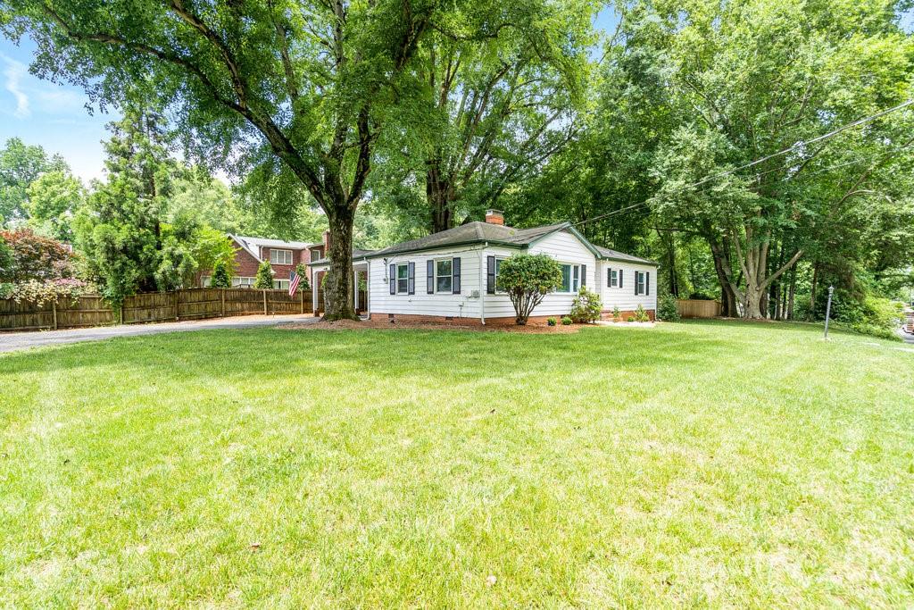 4326 Castleton Road Charlotte, NC 28211 - Photo 27 of 33 a front view of a house with garden