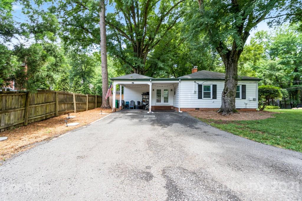 4326 Castleton Road Charlotte, NC 28211 - Photo 28 of 33 a view of a house with backyard and sitting area