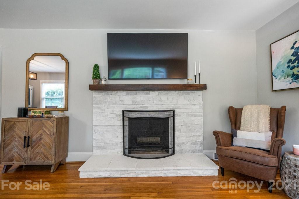 4326 Castleton Road Charlotte, NC 28211 - Photo 6 of 33 a living room with furniture and a fireplace
