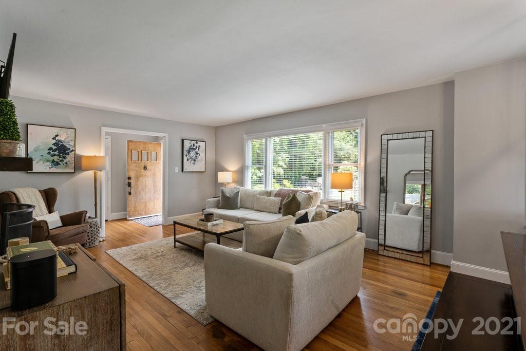 4326 Castleton Road Charlotte, NC 28211 - Photo 7 of 33 a living room with furniture and a large window