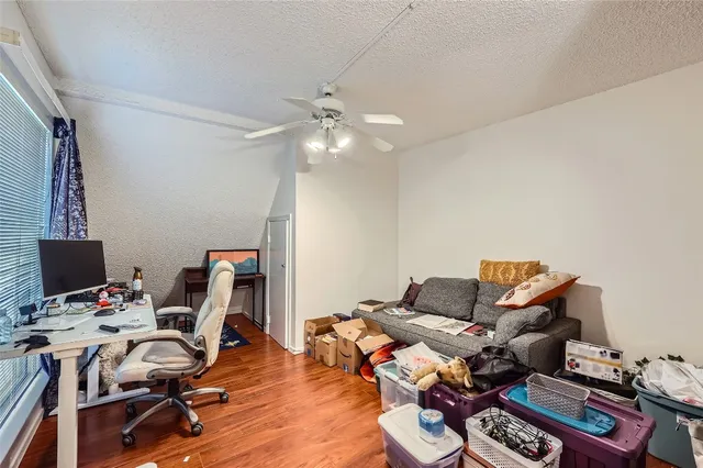 a workspace with furniture and wooden floor