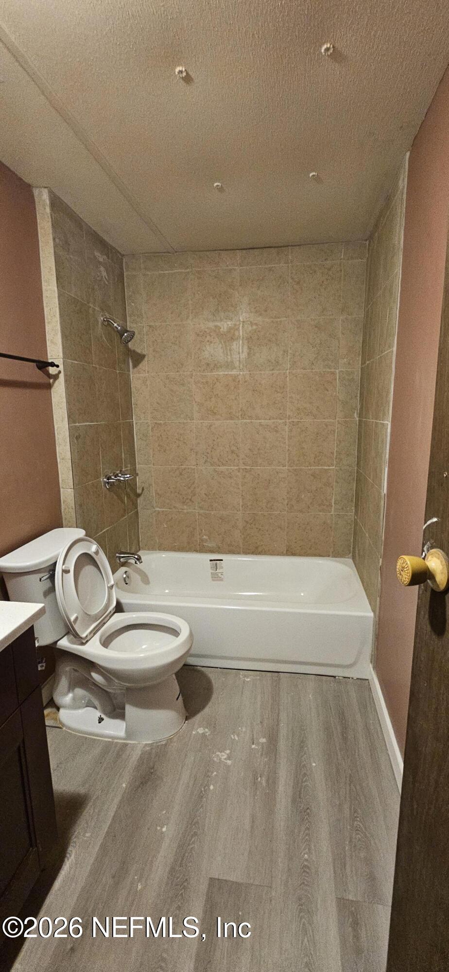 5363 Kilcrease Road Jacksonville, FL 32234 - Photo 14 of 29 a bathroom with a sink a toilet and shower