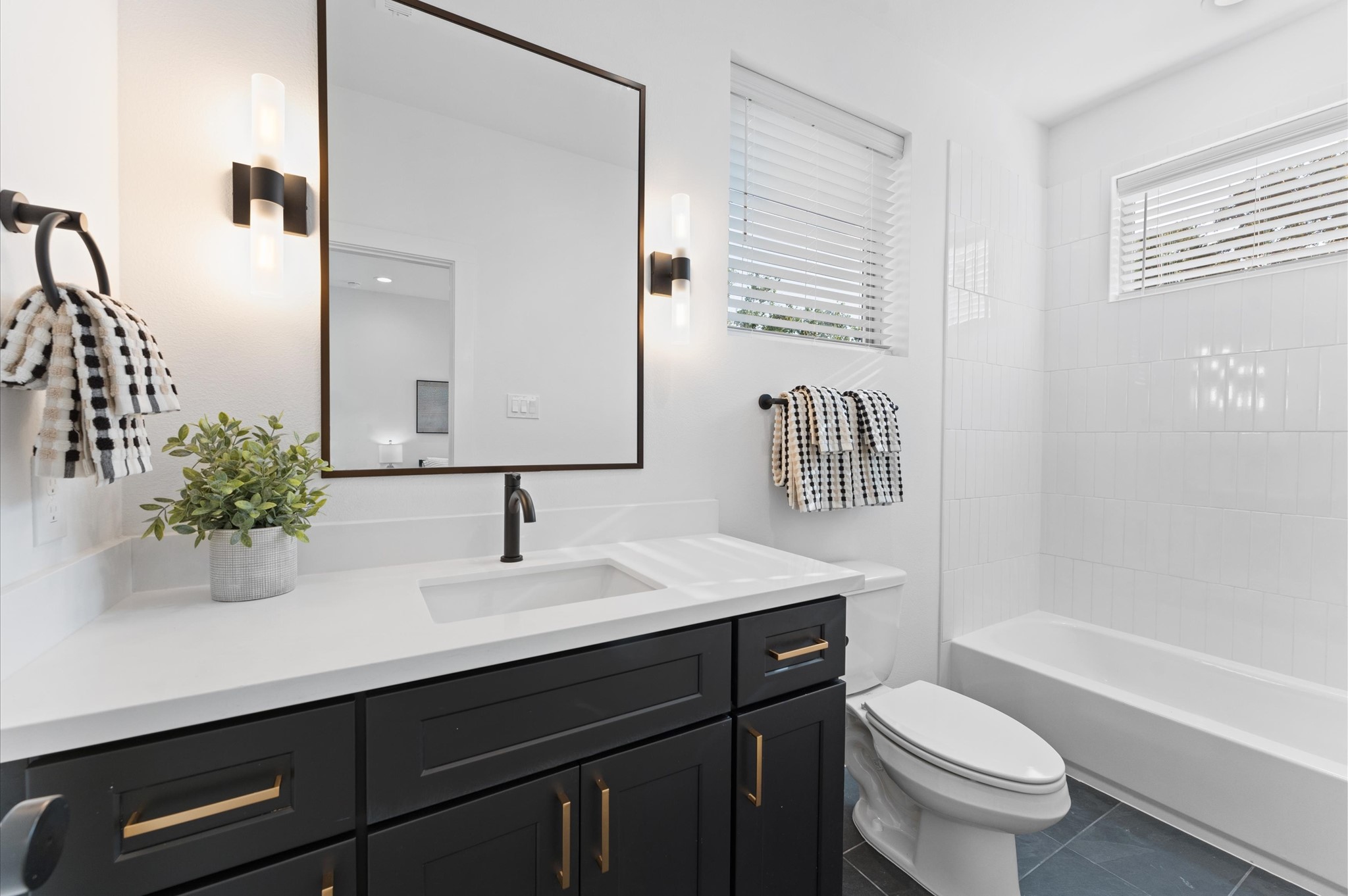 7805 Amelia Road, Unit B Houston, TX 77055 - Photo 34 of 35 Secondary full en-suite bath. Photos are from a previous NJA Homes development. Floor plan, finishes & specifications may vary.