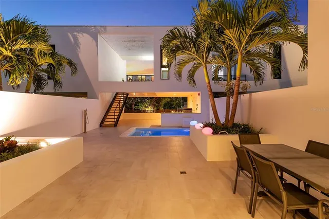 a view of swimming pool with an outdoor seating