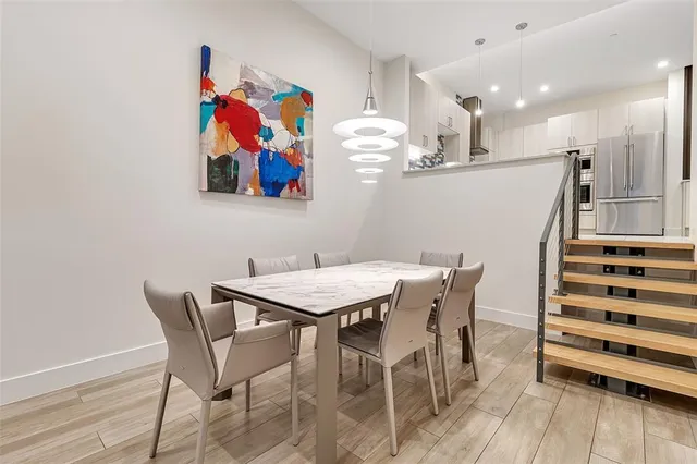 a kitchen with stainless steel appliances kitchen island granite countertop a sink and cabinets