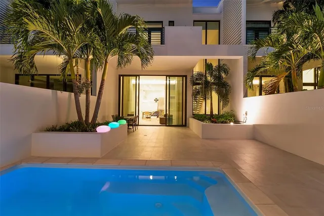 a view of a house with basketball court