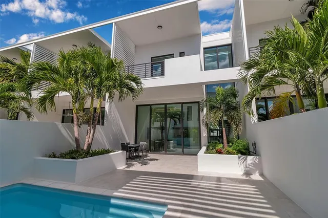 a bedroom with a large bed and a large window