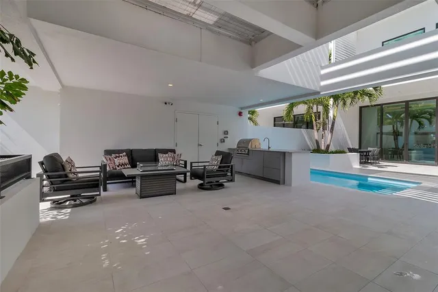 a bathroom with a granite countertop sink a mirror and a shower