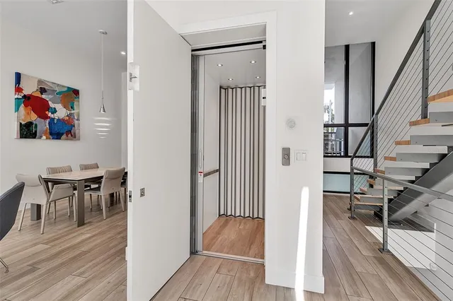 a bedroom with a bed and a night stand