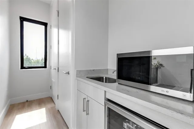 a close view of a utility room with washer and dryer