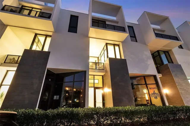 a front view of residential houses with yard