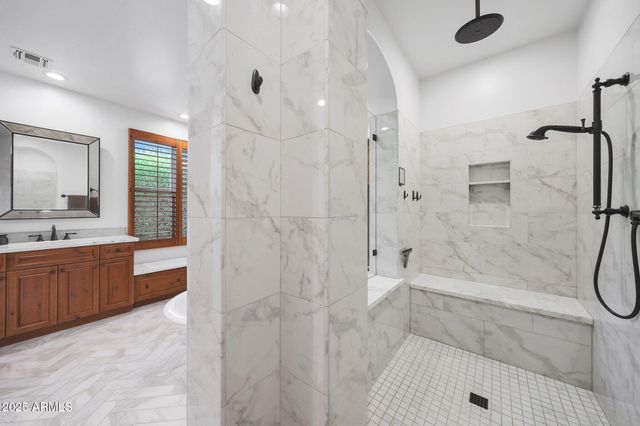 a bathroom with a shower toilet and a shower