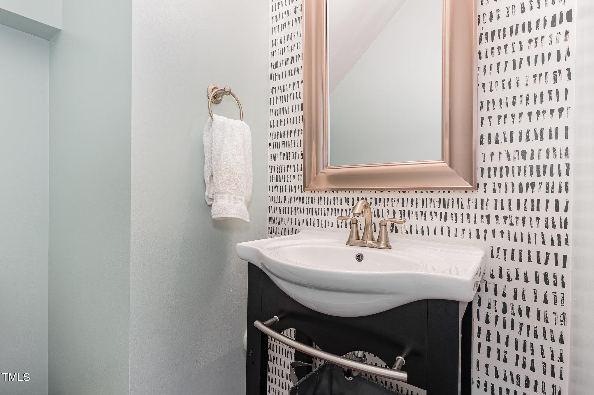1427 Van Page Boulevard Raleigh, NC 27607 - Photo 12 of 28 a bathroom with a sink a mirror and vanity