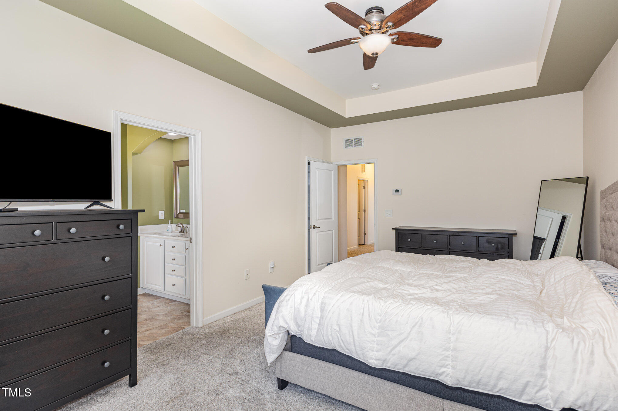 1427 Van Page Boulevard Raleigh, NC 27607 - Photo 14 of 28 a bedroom with a bed and a flat screen tv