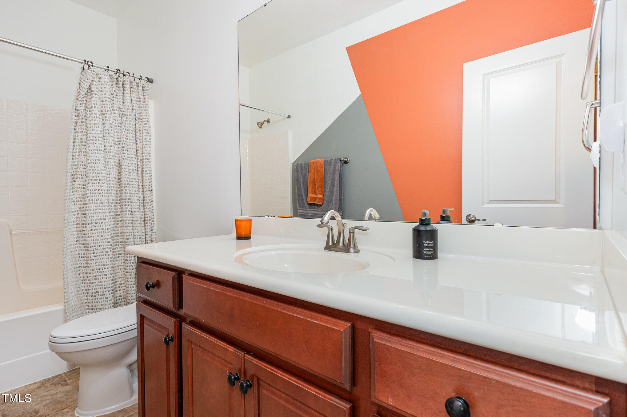 1427 Van Page Boulevard Raleigh, NC 27607 - Photo 21 of 28 a bathroom with a sink and a mirror