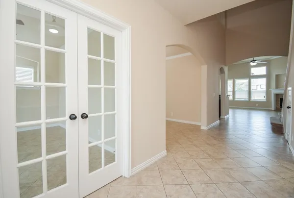 a view of an entryway with wooden floor and a window
