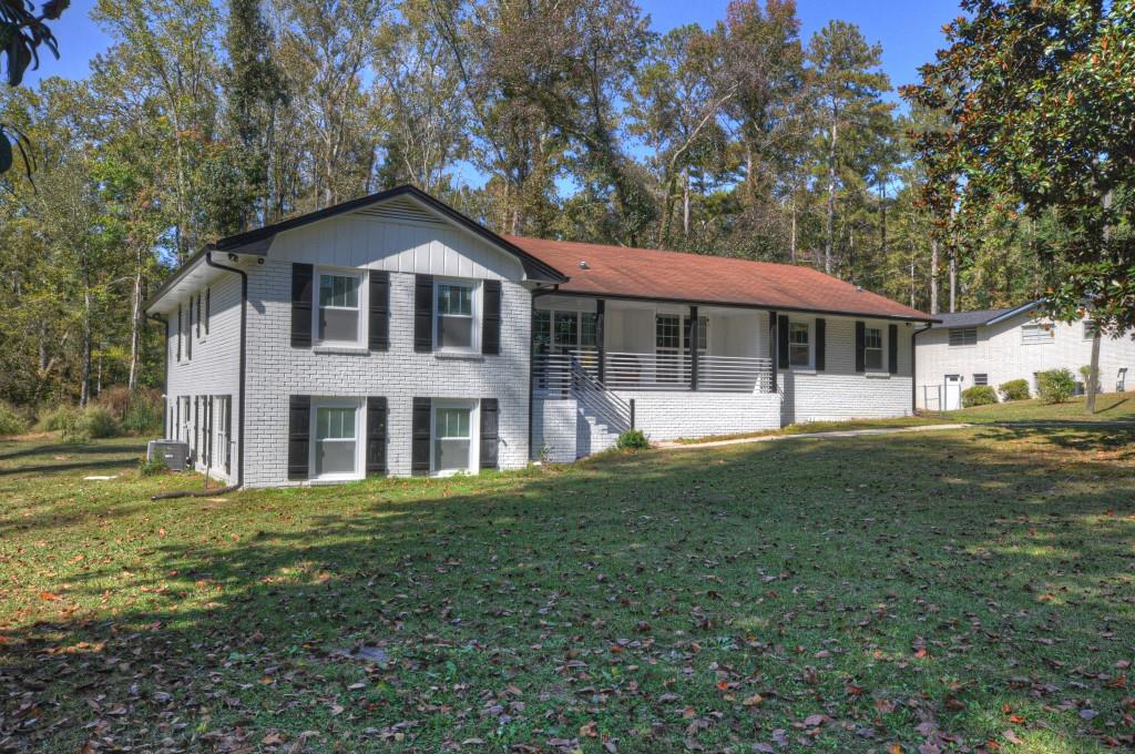 1385 Reynolds Road Southwest Atlanta, GA 30331 - Photo 1 of 1 a front view of a house with a yard