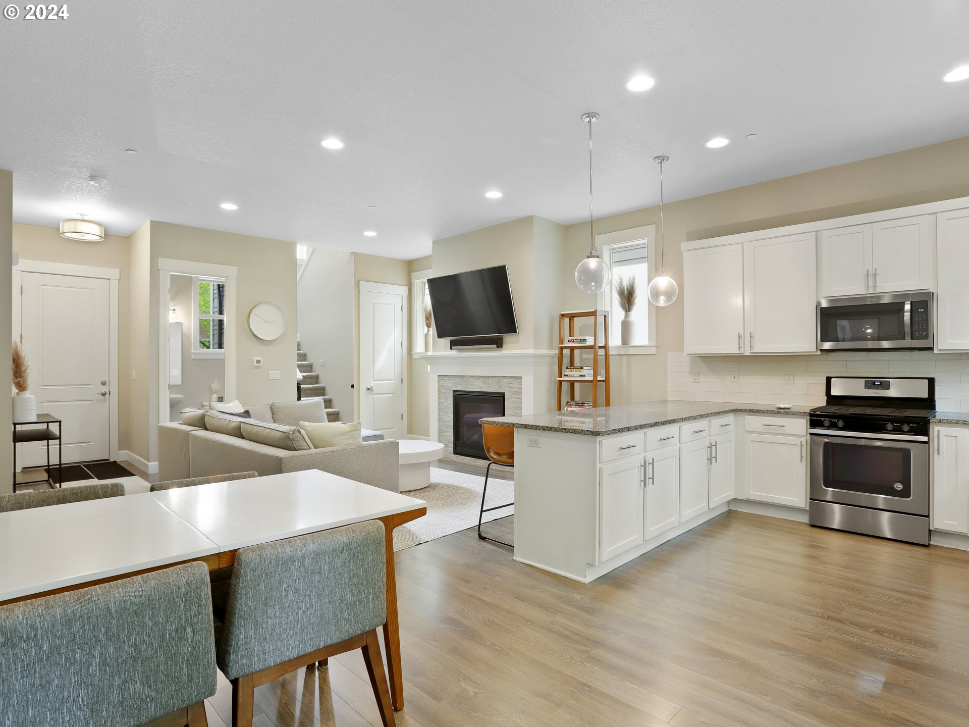 8087 Southwest Oldham Drive Beaverton, OR 97007 - Photo 13 of 46 a kitchen with sink a microwave and cabinets