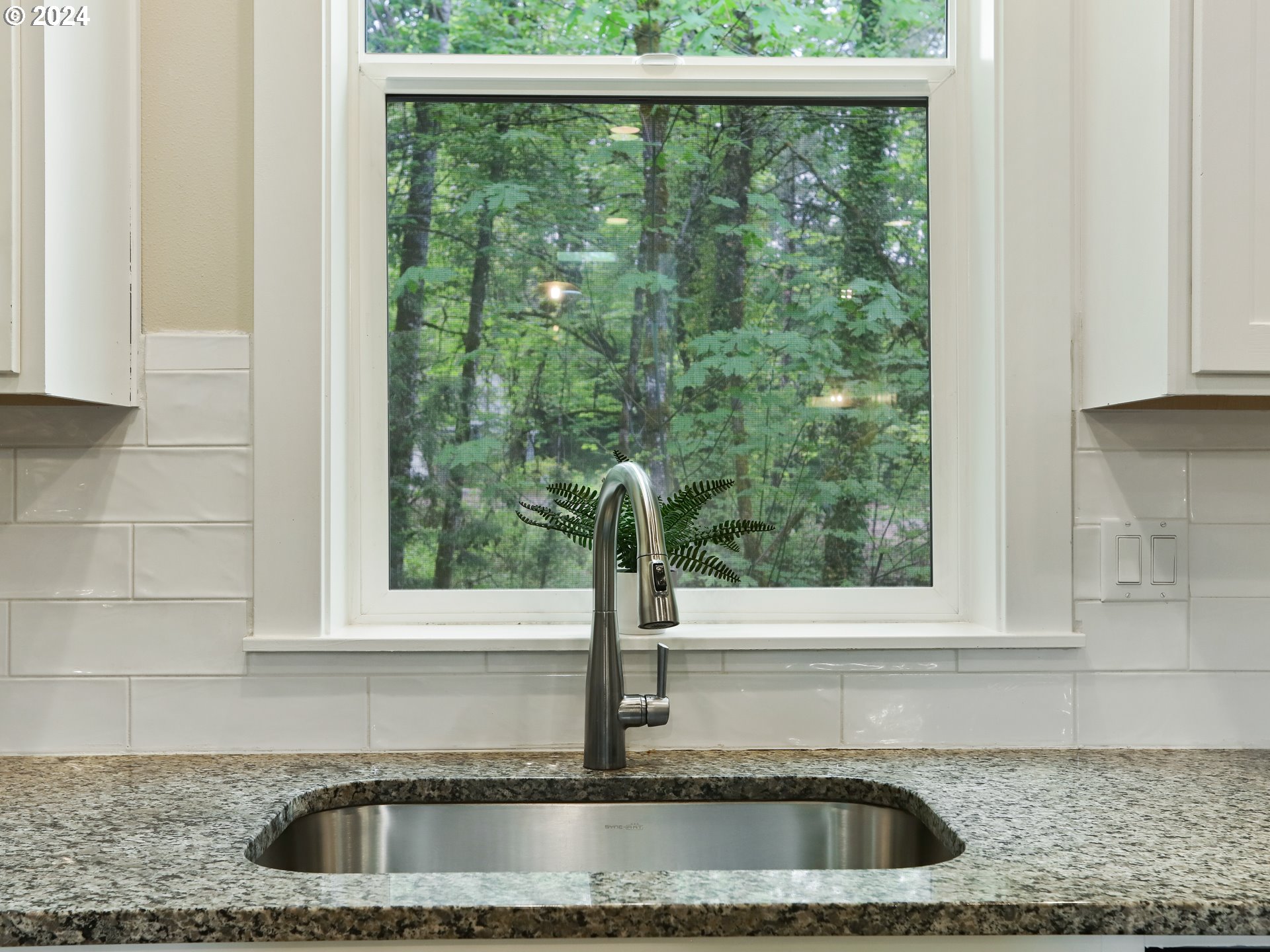 8087 Southwest Oldham Drive Beaverton, OR 97007 - Photo 17 of 46 a kitchen view with a sink and wooden floor