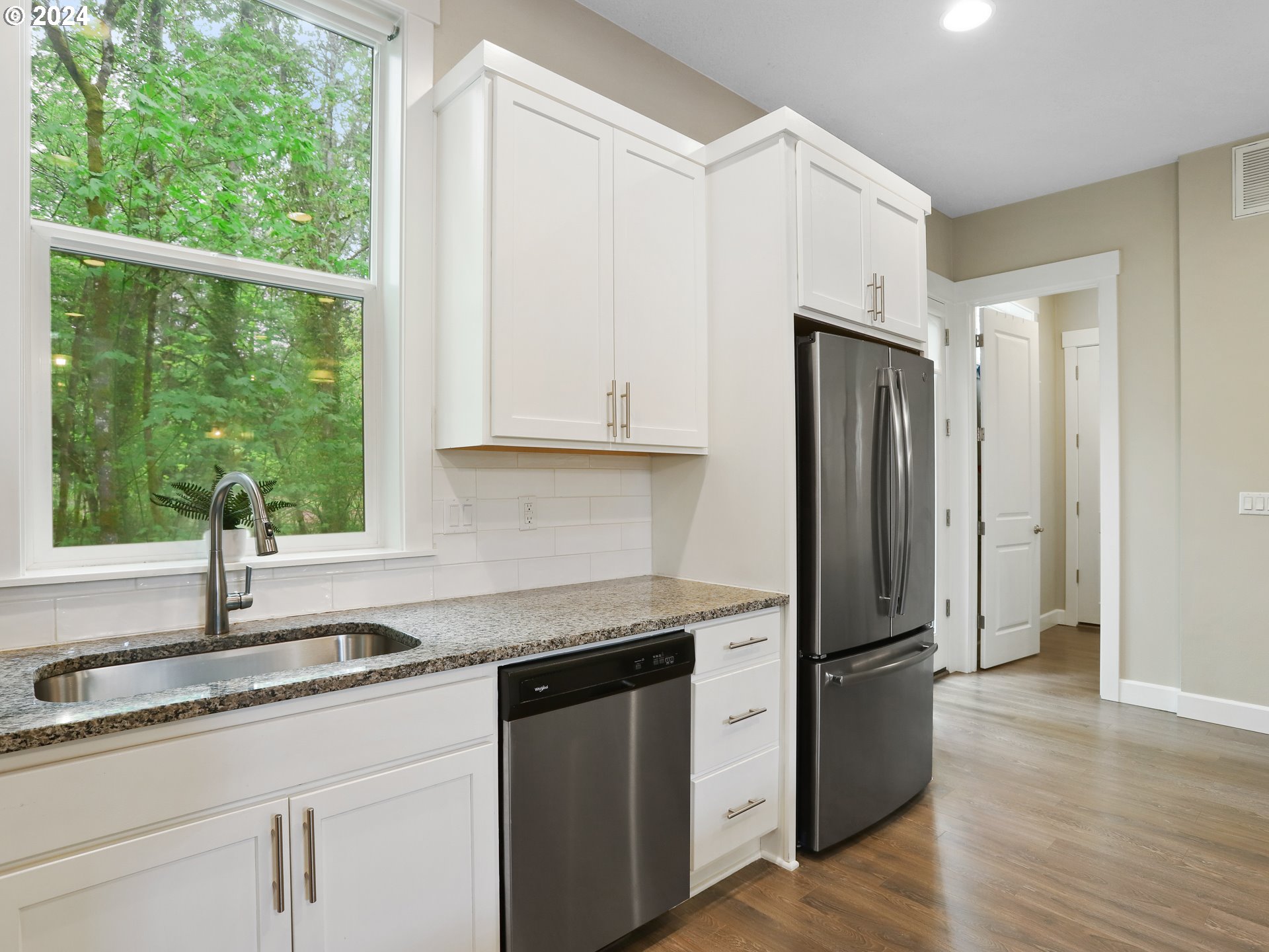 8087 Southwest Oldham Drive Beaverton, OR 97007 - Photo 18 of 46 a kitchen with stainless steel appliances granite countertop a refrigerator and a sink