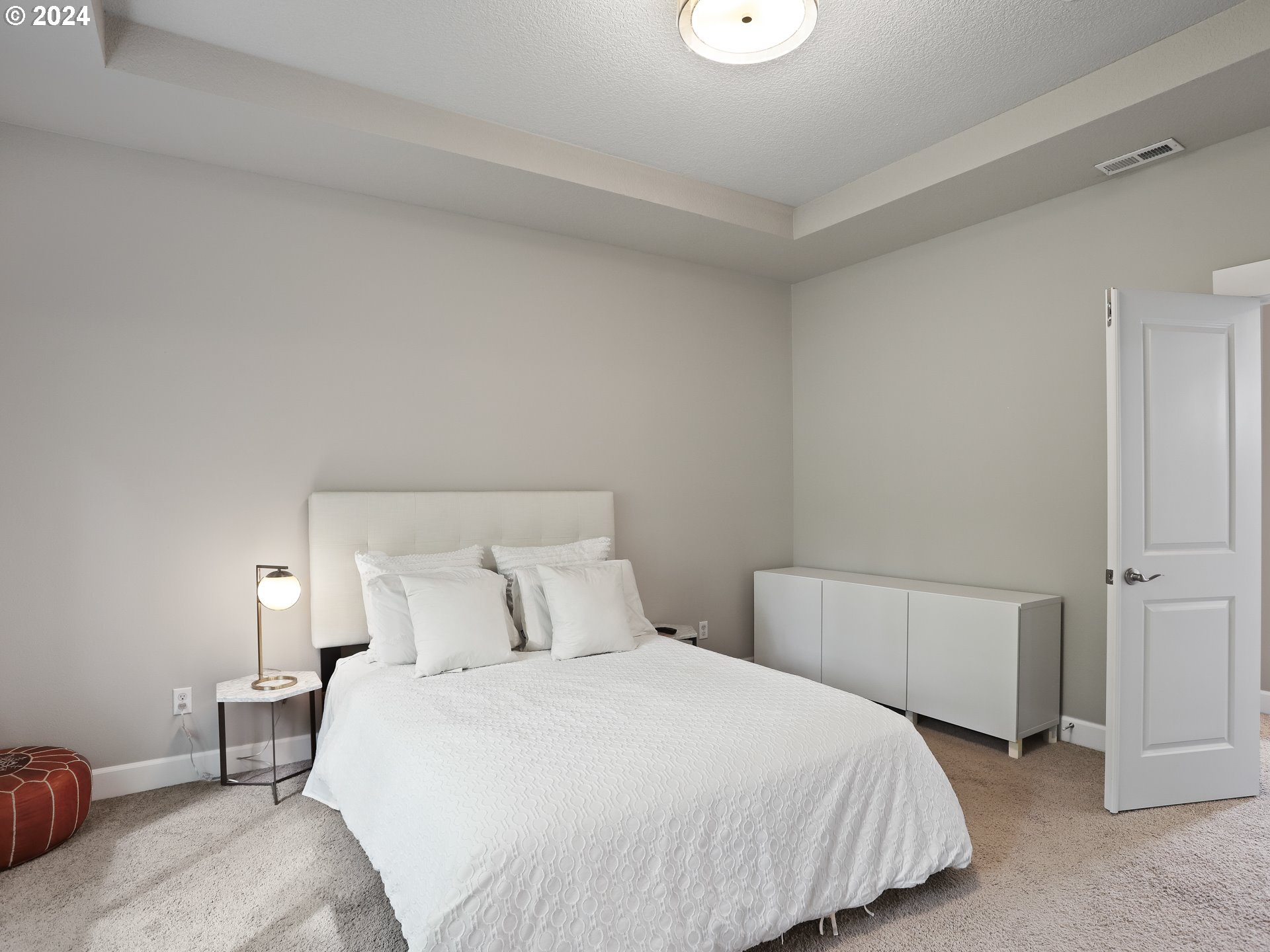 8087 Southwest Oldham Drive Beaverton, OR 97007 - Photo 24 of 46 a bedroom with a bed and a lamp