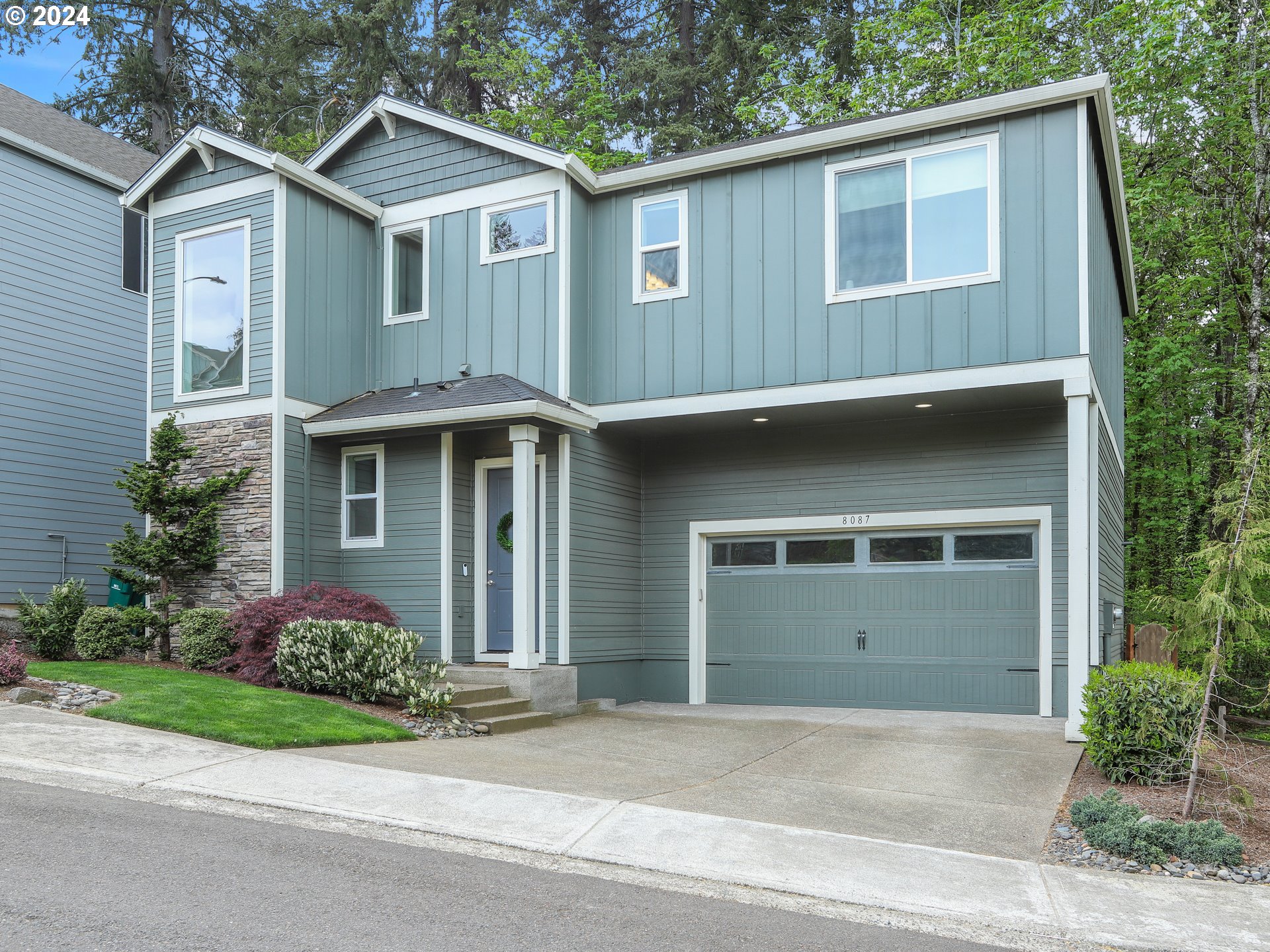8087 Southwest Oldham Drive Beaverton, OR 97007 - Photo 3 of 46 a front view of a house with garden